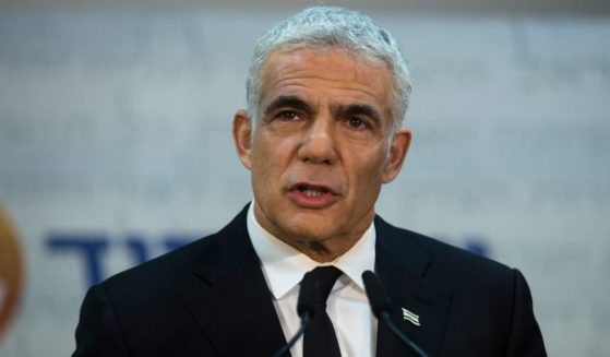 Yair Lapid, Israel's new foreign minister, talks to reporters during a May 6 news conference.
