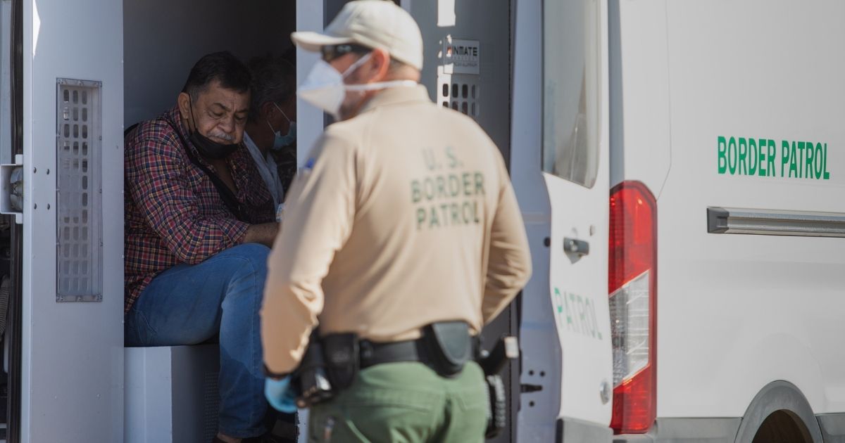 Border Patrol agents process illegal immigrants who turned themselves in in Yuma, Arizona, on May 13.