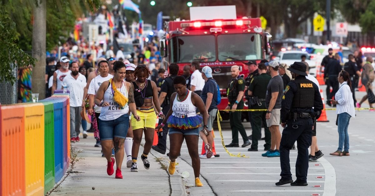 Police investigate the scene where a pickup truck drove into a crowd at a gay pride parade Sunday in Wilton Manors, Florida.