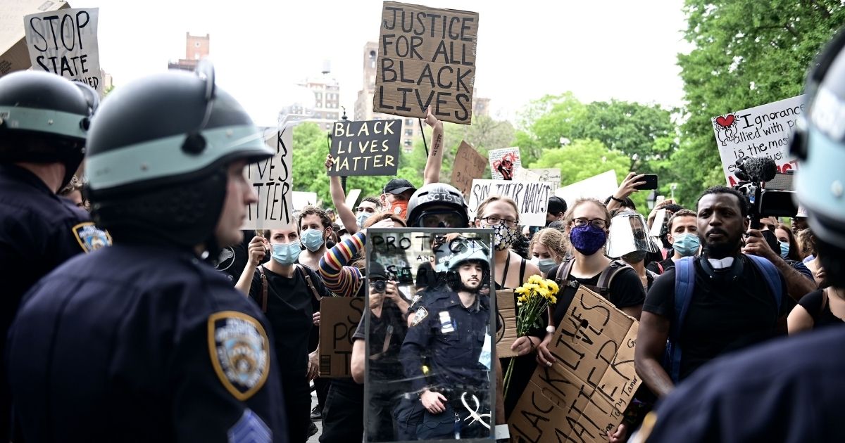 New York City police square off with demonstrators in June 2020 in Manhattan's Washington Square Park.