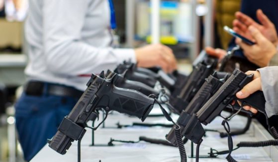 Handguns on display at a gun store.