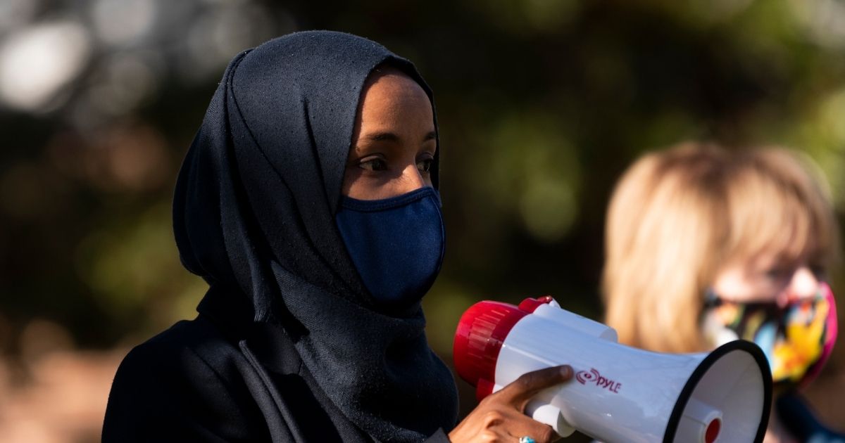 Then-Minnesota Democratic Congressional candidate Ilhan Omar, joined by then-Democratic Senate candidate Tina Smith, speaks during a get out the vote event on the University of Minnesota on Nov. 3, 2020, in Minneapolis, Minnesota.
