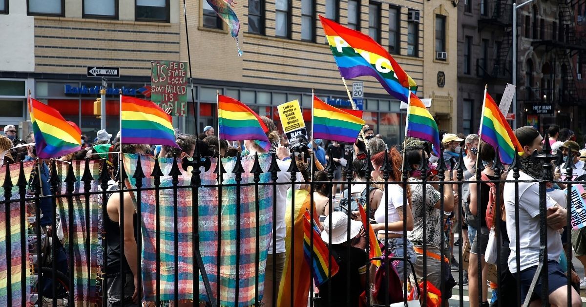 Marchers congregate in front of the Stonewall Inn during the Queer Liberation March for Black Lives & Against Police Brutality on June 28, 2020.
