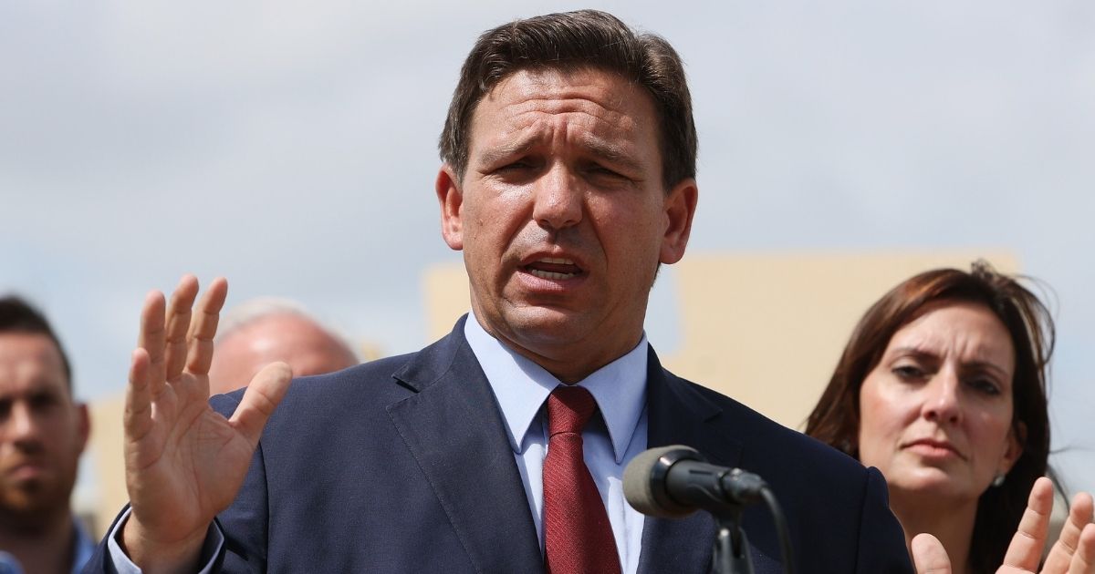 Florida Gov. Ron DeSantis speaks during a news conference held at the Florida National Guard Robert A. Ballard Armory on Monday in Miami.