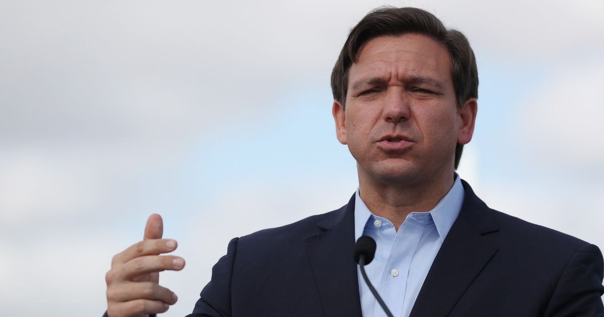Florida Gov. Ron DeSantis speaks during a news conference in the Hard Rock Stadium parking lot on March 30, 2020, in Miami Gardens, Florida.