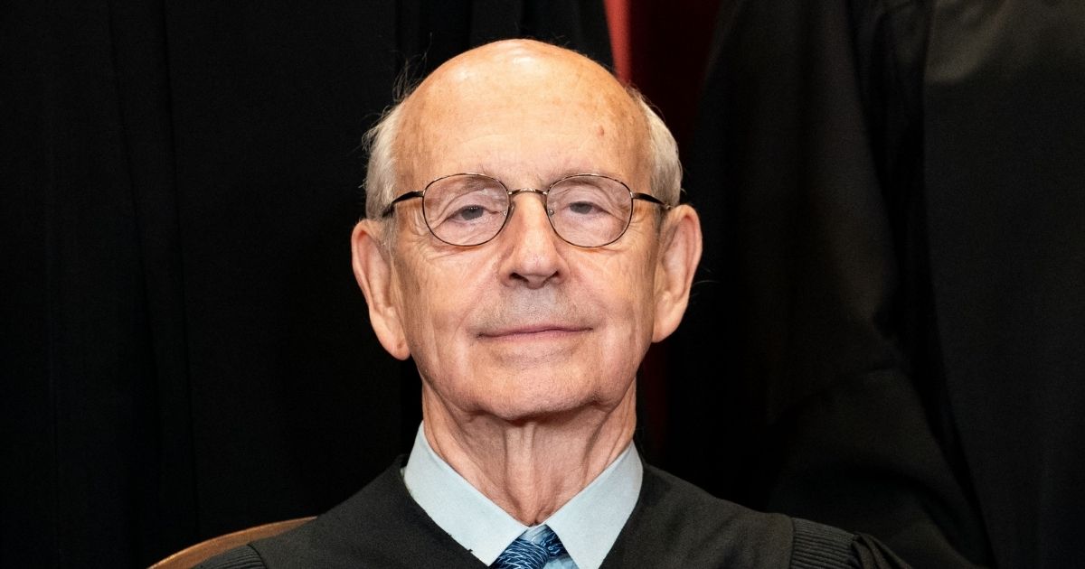 Associate Justice Stephen Breyer sits during a group photo of the Supreme Court justices at the Supreme Court in Washington, D.C., on April 23, 2021
