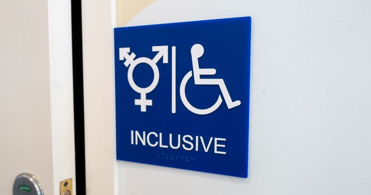A sign for an inclusive restroom, with the symbol indicating male, female and transgender, as well as handicapped symbol, as part of LGBT rights initiatives in the Mission District neighborhood of San Francisco on July 18, 2019.