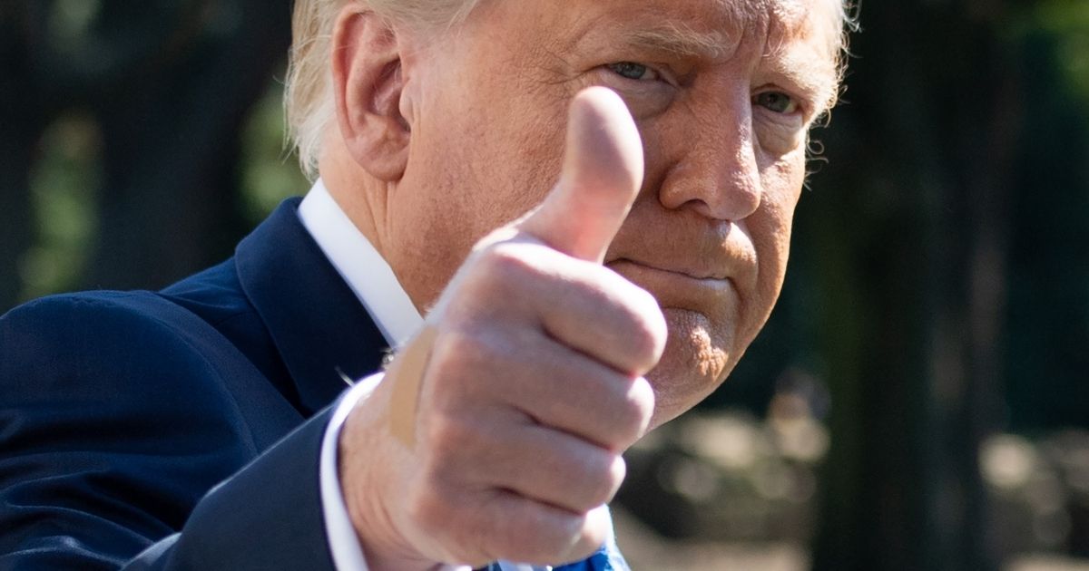 Then-President Donald Trump gives a thumbs-up as he departs the White House in Washington, DC, on Oct. 15, 2020.