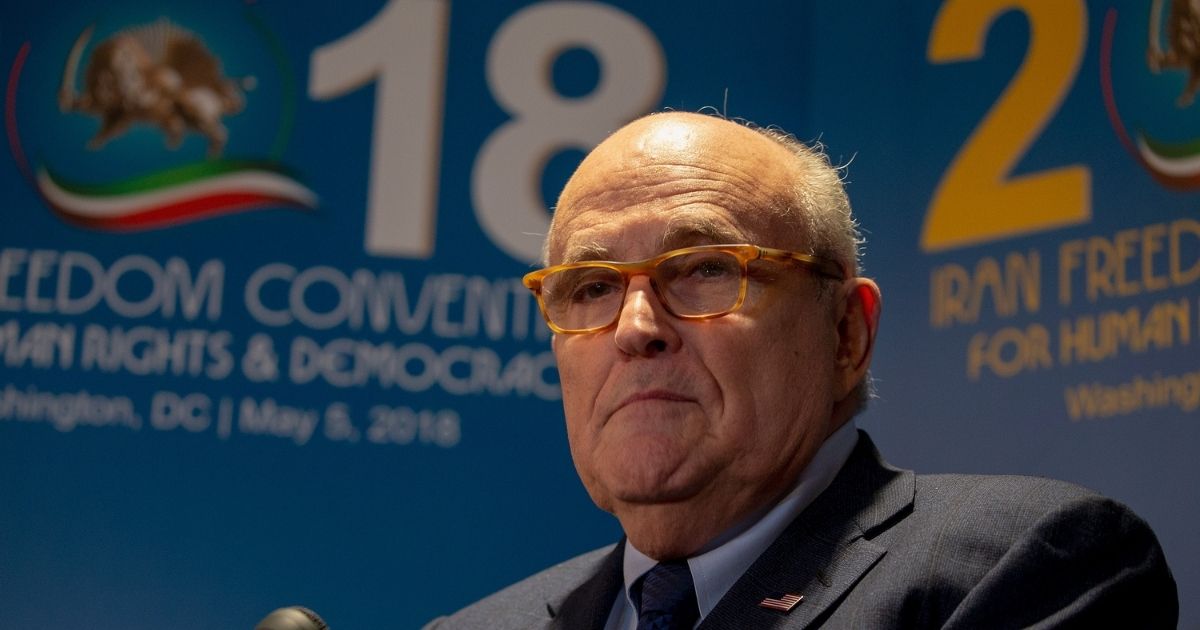 Former Mayor of New York City Rudy Giuliani takes questions from the media after speaking at the Conference on Iran on May 5, 2018, in Washington, D.C.