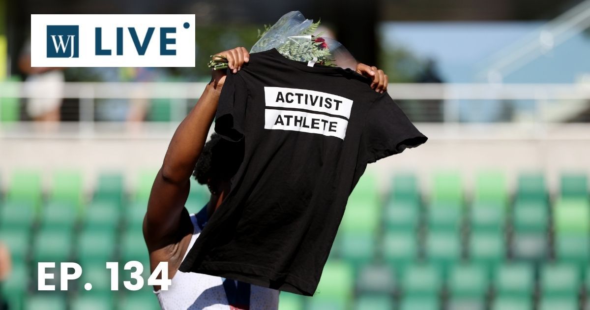 Gwendolyn Berry displays an Activist Athlete shirt as she celebrates finishing third in the Women's Hammer Throw final on day nine of the 2020 U.S. Olympic Track & Field Team Trials at Hayward Field on Sunday in Eugene, Oregon.