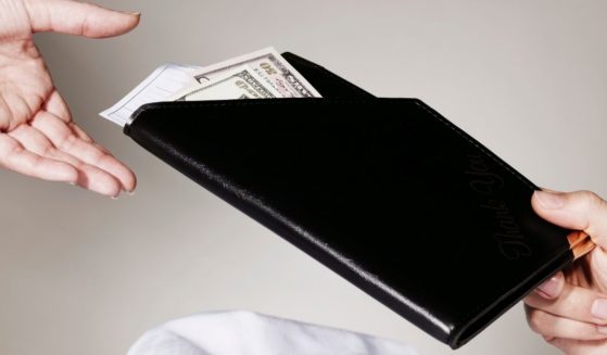 The above stock photo shows a check and a tip.