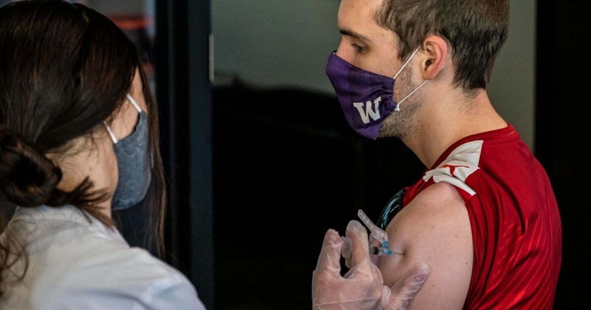 A student receives a COVID-19 vaccine shot at a clinic on the University of Washington campus in Seattle on May 18.