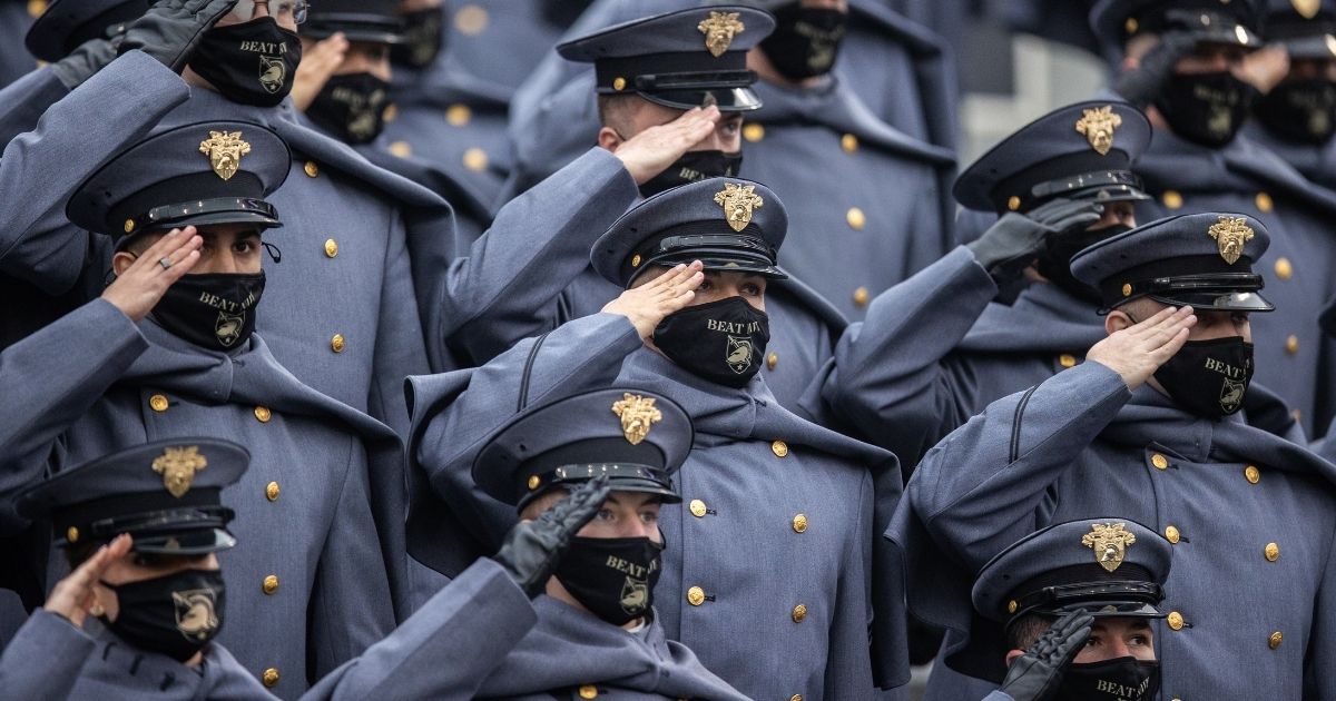 United States Military Academy Corps of Cadets salute during the national anthem before the start of a game between the Army Black Knights and the Navy Midshipmen at Michie Stadium on Dec. 12, 2020, in West Point, New York.
