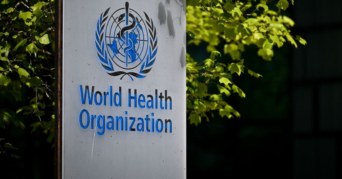 A picture taken on May 8 shows a sign of the World Health Organization at the entrance of its headquarters in Geneva.