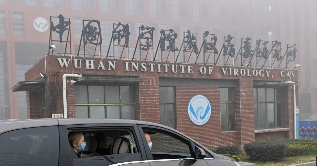 Members of the World Health Organization team investigating the origins of COVID-19 arrive at the Wuhan Institute of Virology in Wuhan in China's central Hubei province on Feb. 3, 2021.