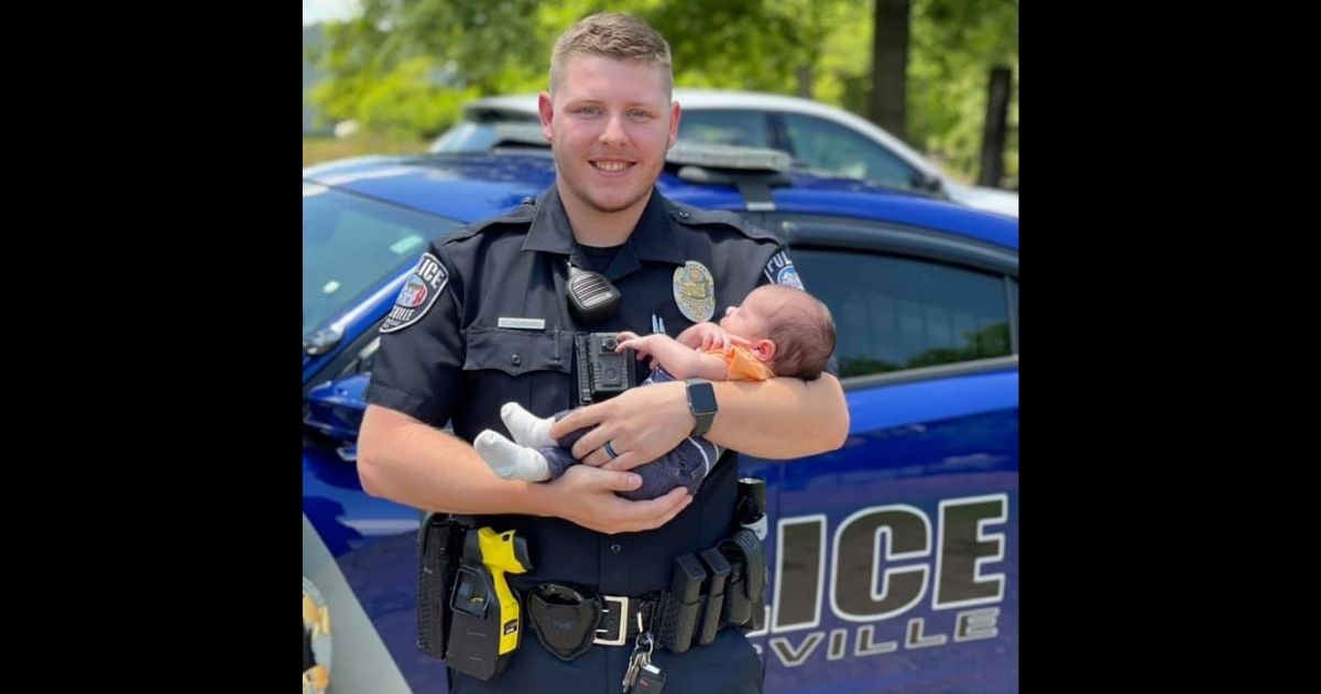 Officer Cody Hubbard and baby Grady, whose life the rookie officer saved in late May.