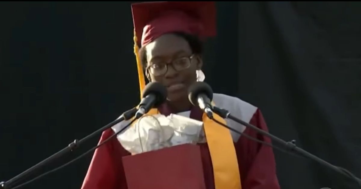 Verda Tetteh, 17, at her graduation, announcing that she would be giving her $40,000 scholarship away.