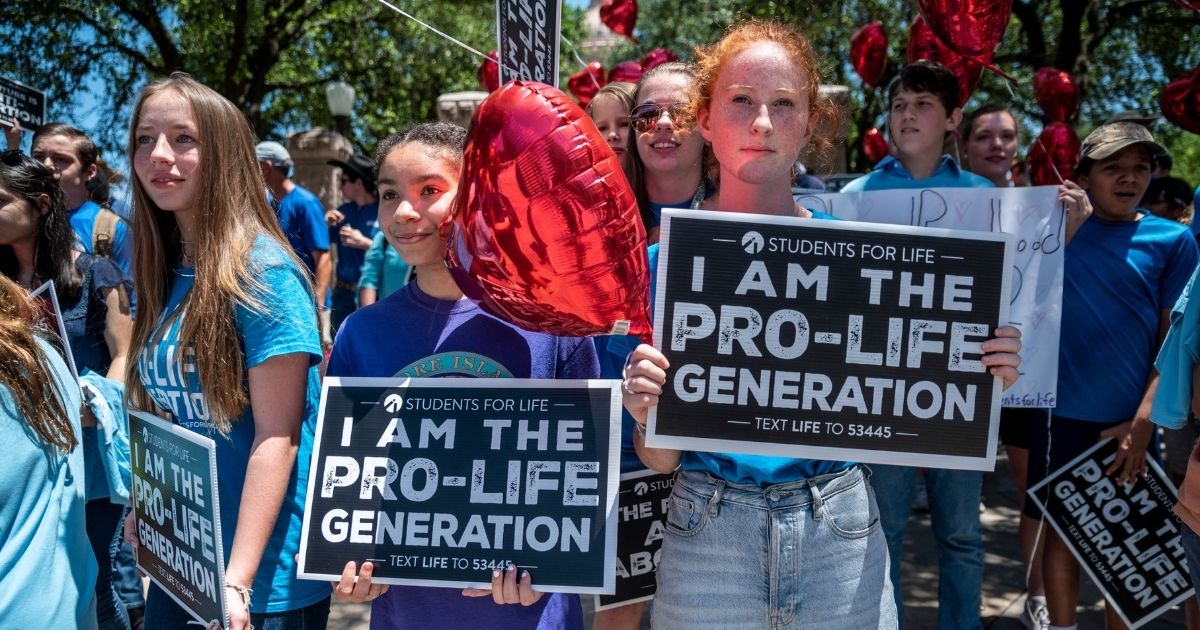 Pro-life protesters stand outside the Texas Capitol on May 29, 2021, in Austin, Texas.
