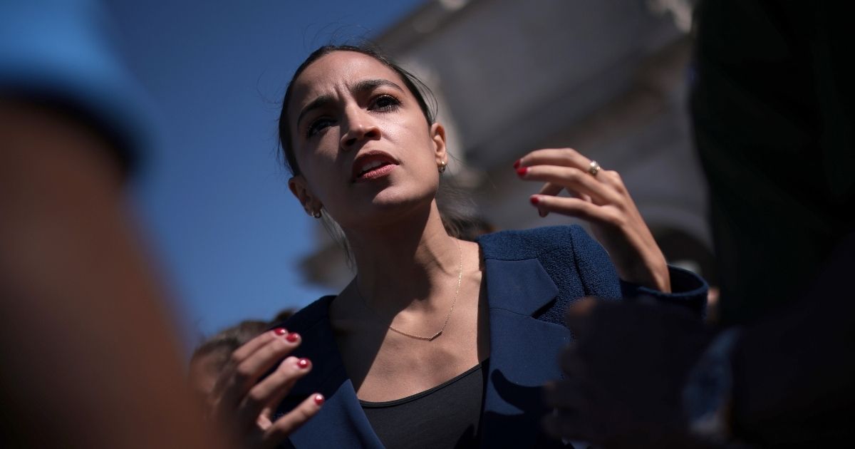 Democratic Rep. Alexandria Ocasio-Cortez of New York speaks with supporters during an event outside Union Station on June 16, 2021, in Washington, D.C.