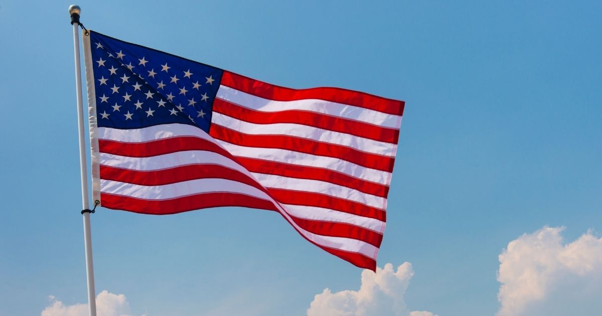 An American flag is pictured in Jersey City, New Jersey, in the stock image above.