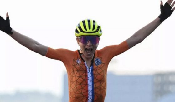 Dutch cyclist Annemiek van Vleuten raises her arms in victory Sunday, before learning she didn't win her race.