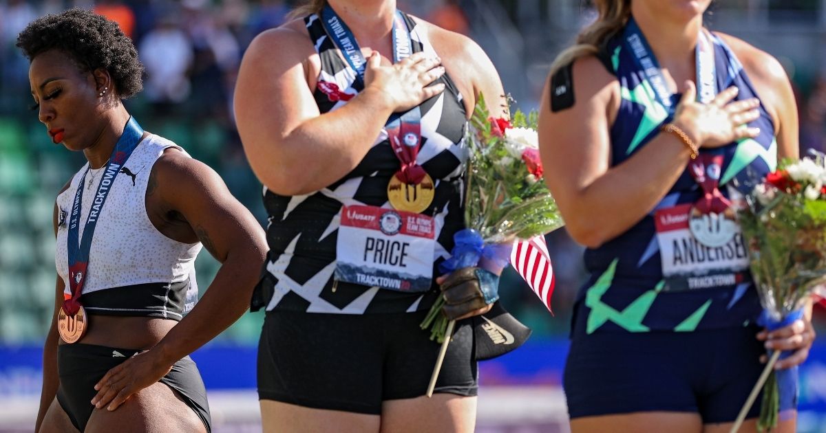 Gwen Berry, who finished in third place, turns away from American flag during the national anthem after the women's hammer throw final at the U.S. Olympic Track & Field Team Trials at Hayward Field in Eugene, Oregon, on June 26.