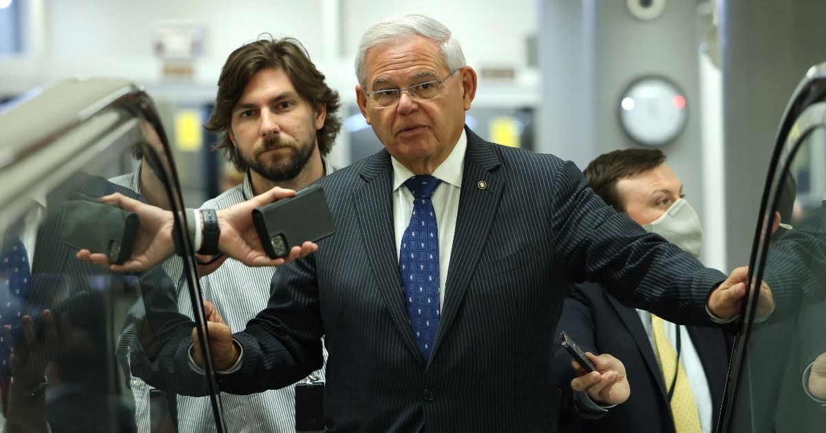 Democratic Sen. Robert Menendez of New Jersey speaks to reporters in the Senate Subway on Capitol Hill on July 20, 2021, in Washington, D.C.