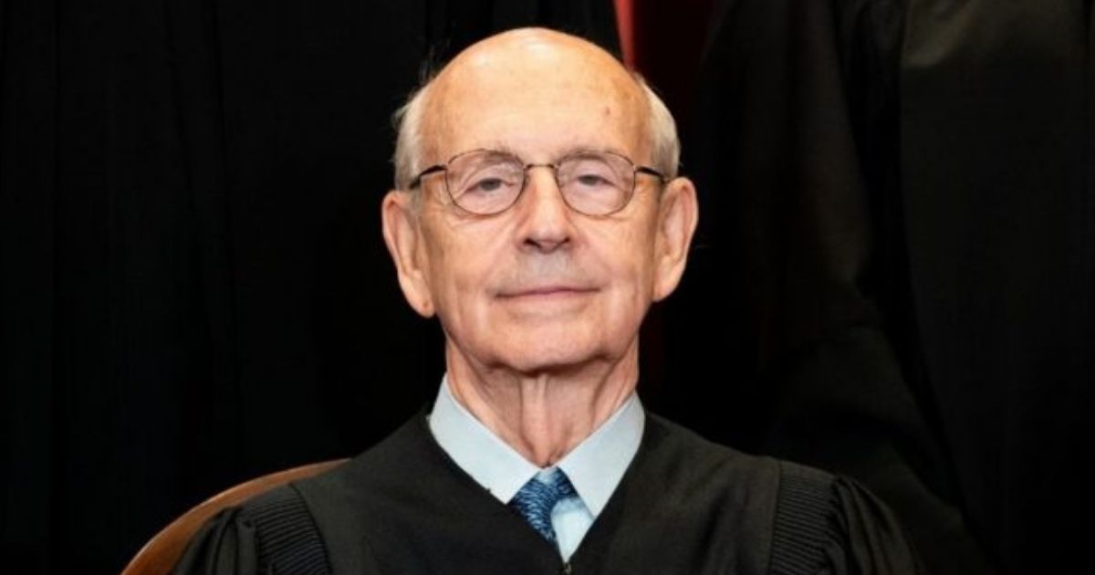 Associate Justice Stephen Breyer sits during a group photo of the justices at the Supreme Court in Washington on April 23.