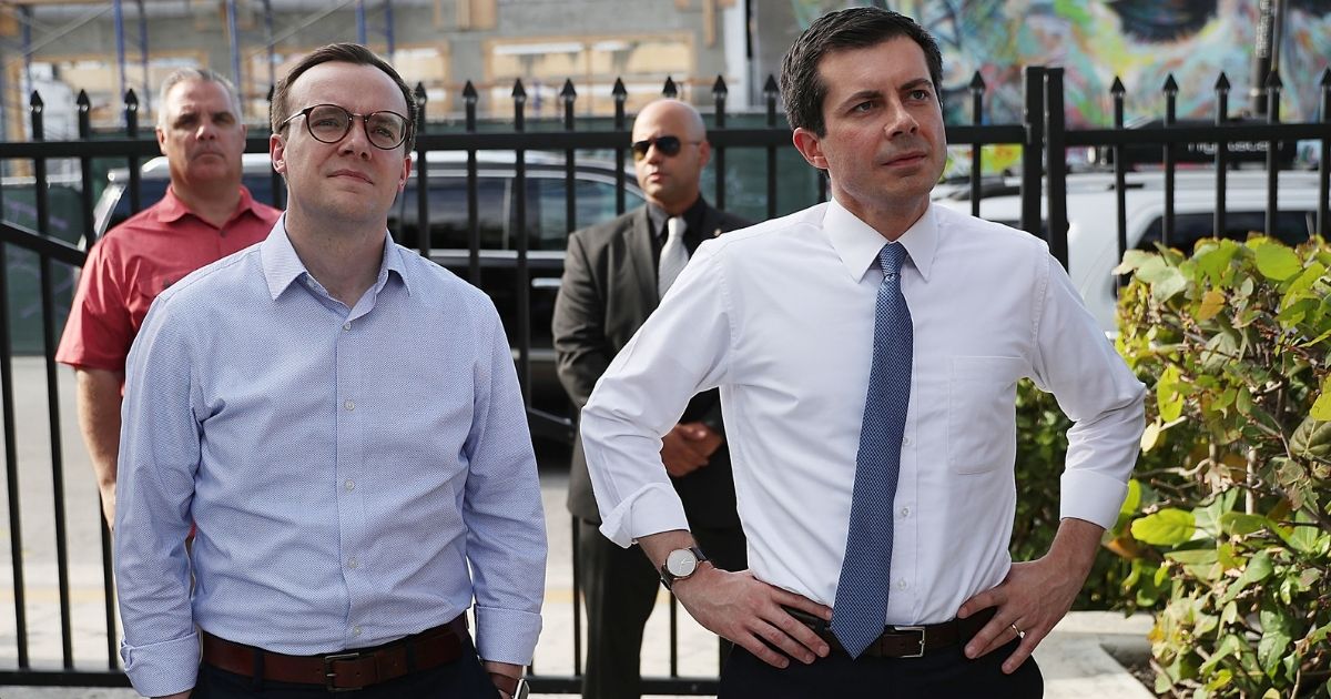 Then-Democratic presidential candidate Pete Buttigieg, right, and his husband, Chasten, wait to be introduced during a fundraiser at the Wynwood Walls in Miami on May 20, 2019.