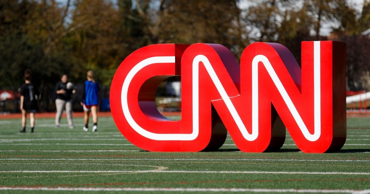 A CNN sign rests on an athletic field outside the Clements Recreation Center before a Democratic presidential primary debate at Otterbein University on Oct. 14, 2019, in Westerville, Ohio.