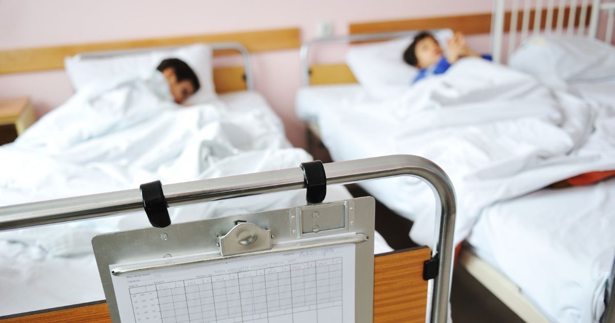 Children are pictured in hospital beds in the stock image above.