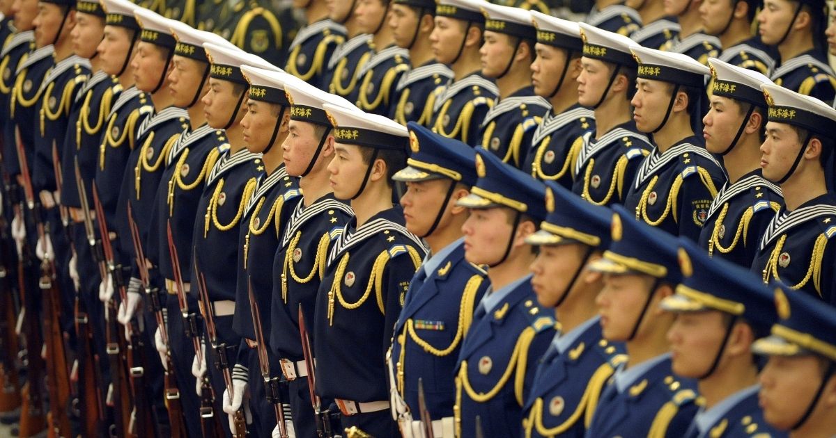 Members of a Chinese People's Liberation Army honour guard line up during a welcome ceremony at the Great Hall of the People in Beijing on Feb. 25, 2010.