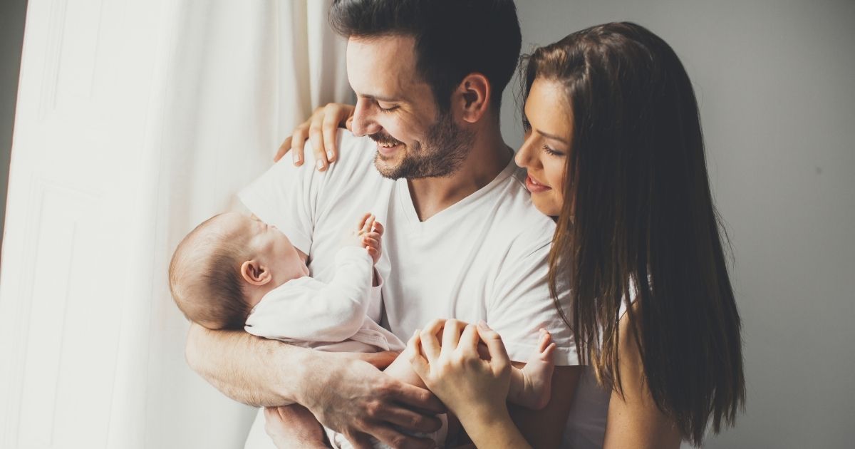 A couple and their baby are pictured in the stock image above.