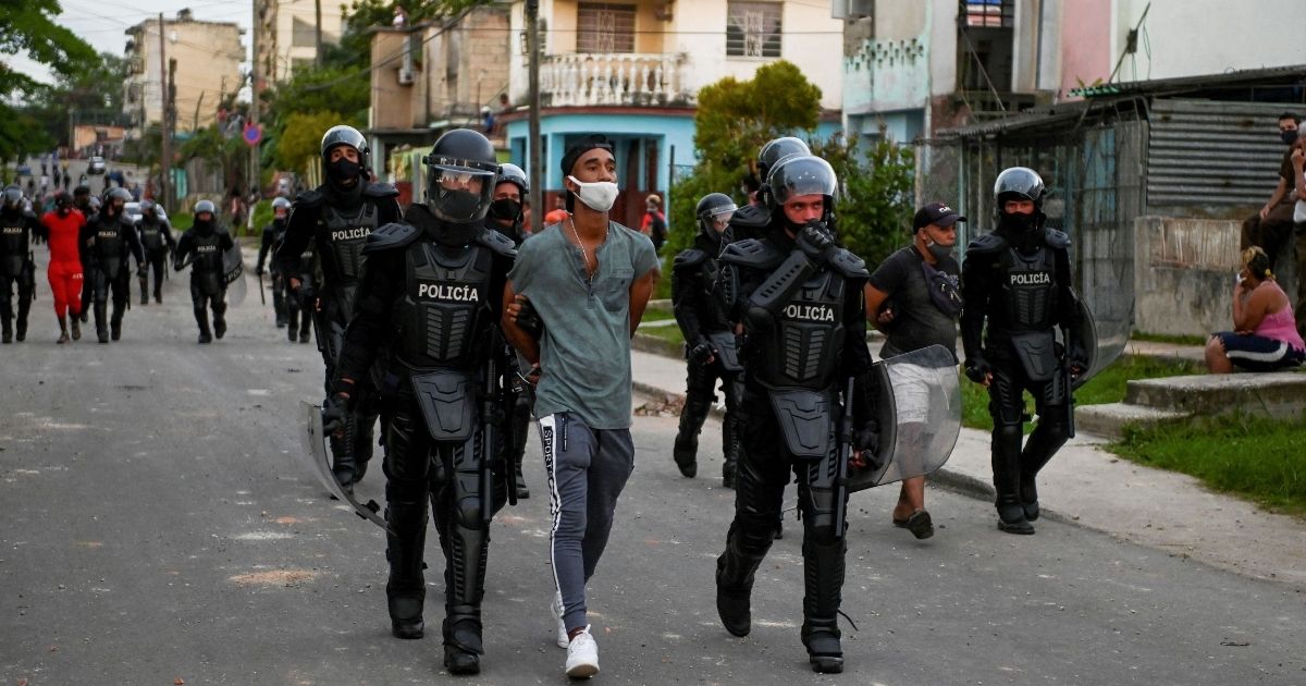 A man is arrested during a demonstration against the government of President Miguel Díaz-Canel in Arroyo Naranjo Municipality, Havana on Monday.