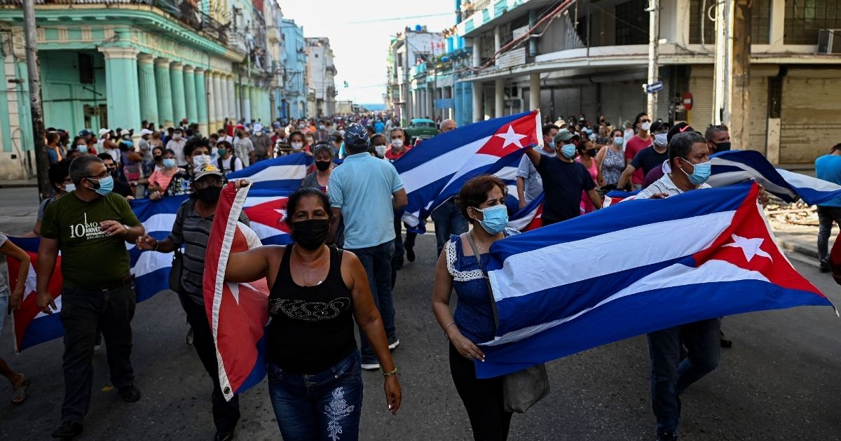 People take part in a demonstration in Havana on Sunday.
