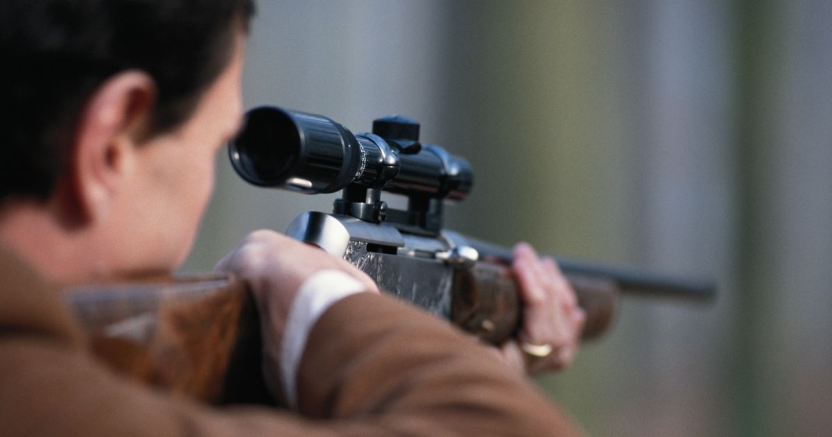 This stock image portrays a man aiming a rifle. The upper house of the Czech parliament has approved the right for citizens to bear arms in the constitution.
