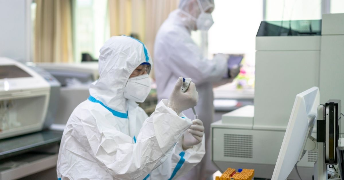 The above stock photo shows two scientists working in a lab.