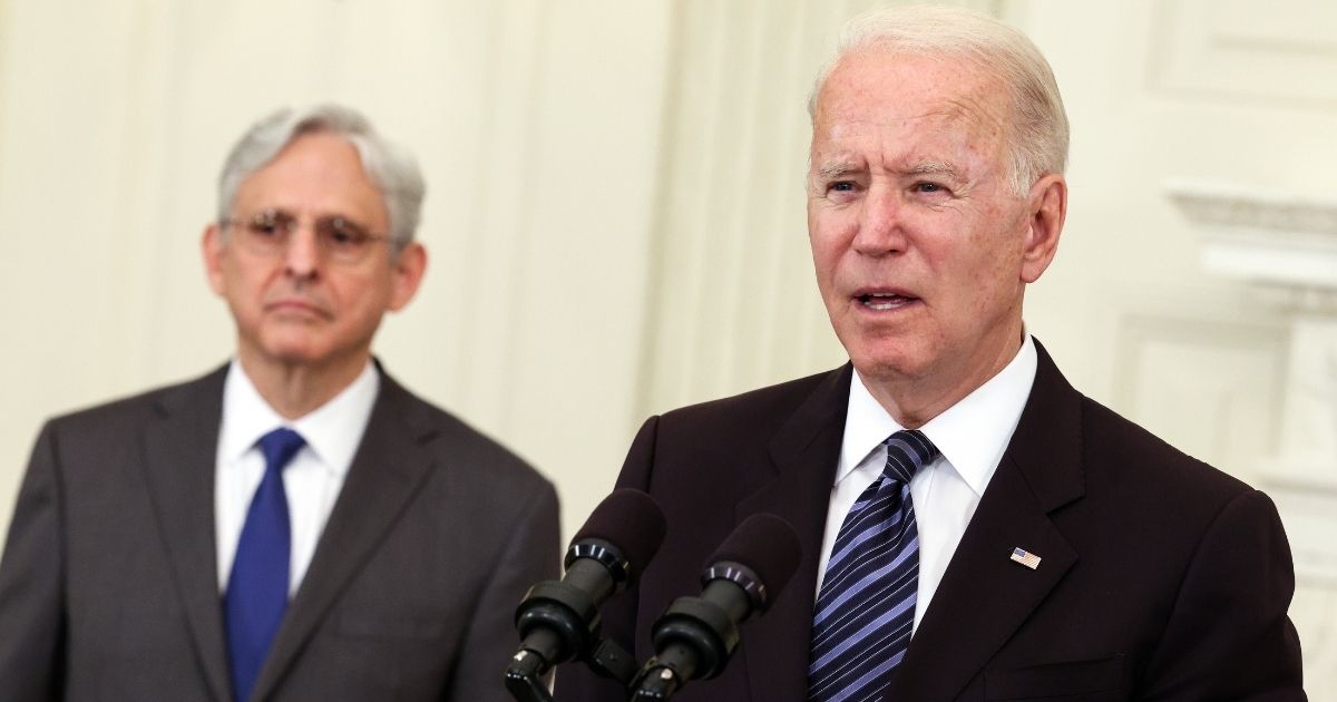 President Joe Biden, joined by Attorney General Merrick Garland, speaks at the White House in Washington on June 23.