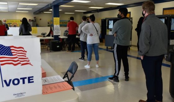 Georgia voters line up at the Sara Smith Elementary School polling station in the Buckhead district of Atlanta during the state's Senate runoff election on Jan. 5.