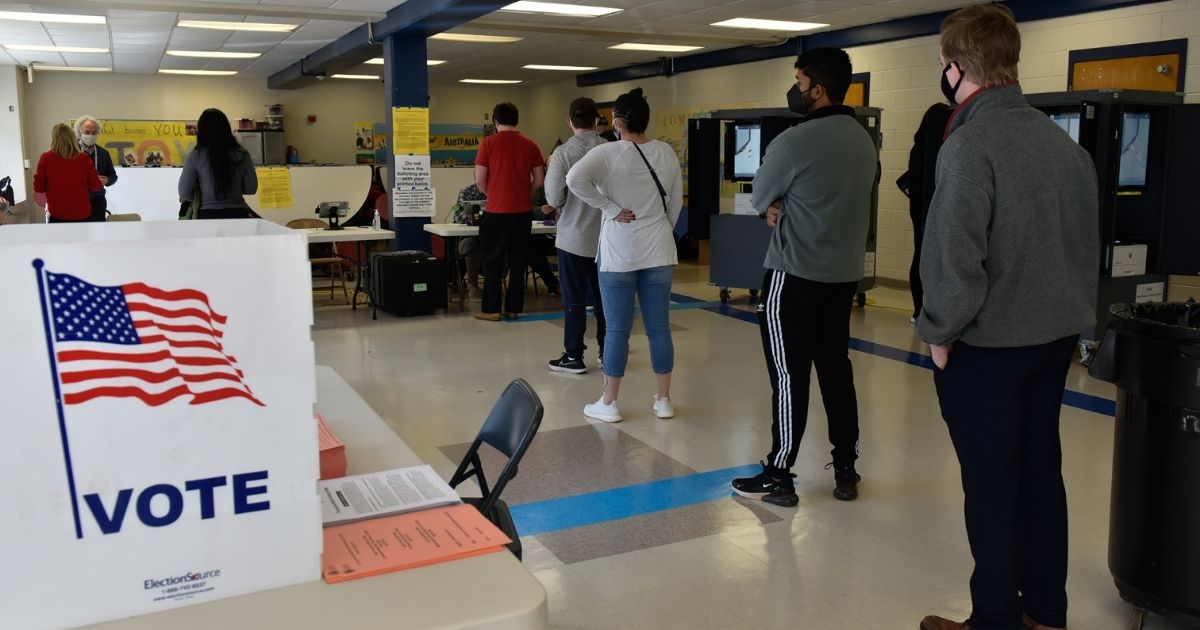 Georgia voters line up at the Sara Smith Elementary School polling station in the Buckhead district of Atlanta during the state's Senate runoff election on Jan. 5.