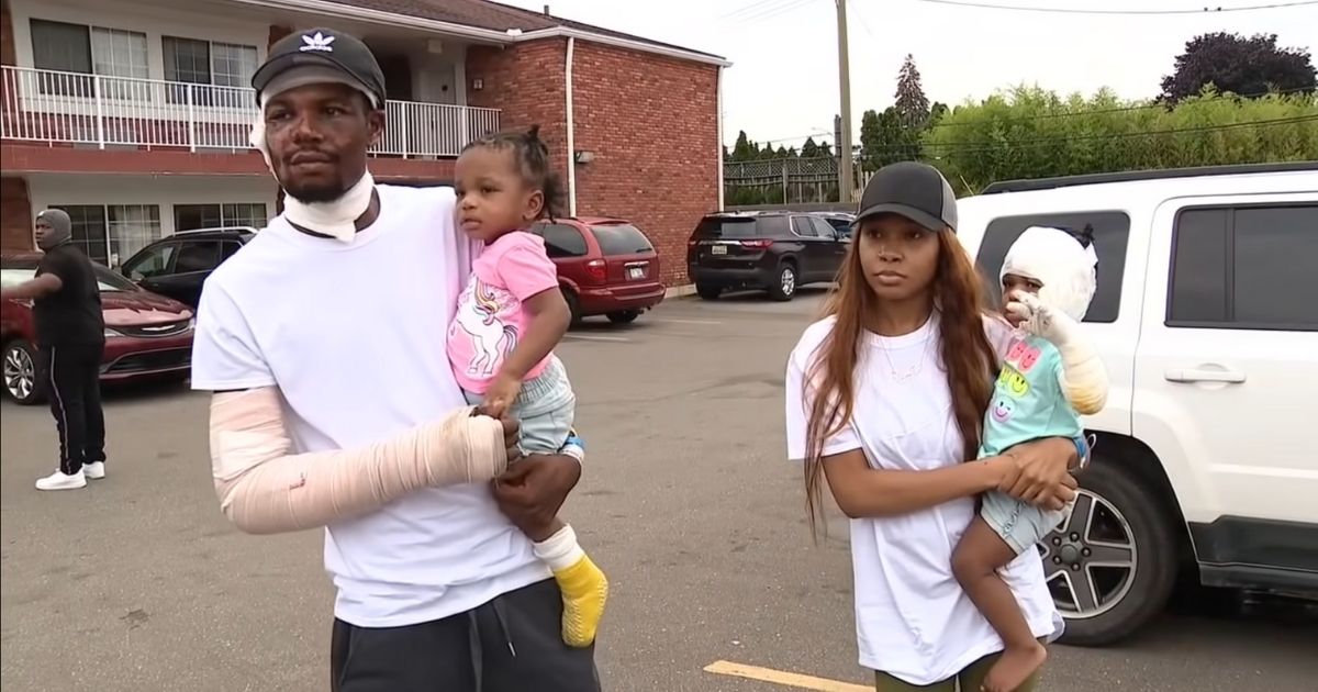 Ray Lucas with his girlfriend, ShiAnn Brown, and their twin daughters, Malaysia and Milan, who were trapped in the basement when the house near Detroit caught fire.