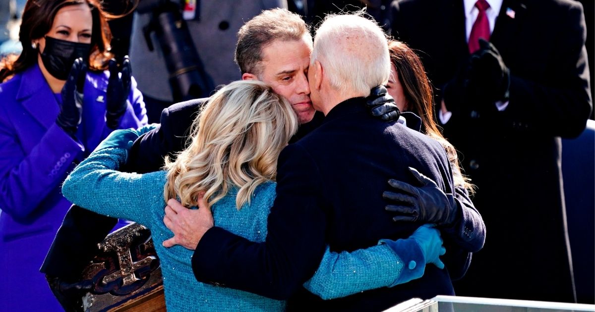 President Joe Biden, right, is comforted by his son Hunter Biden, center, and first lady Jill Biden after being sworn in during the 59th presidential inauguration in Washington, D.C., on the West Front of the U.S. Capitol on Jan. 20, 2021.