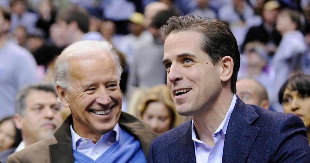Then Vice President Joe Biden, left, and his son Hunter Biden appear at the Duke Georgetown NCAA college basketball game in Washington on Jan. 30, 2010.