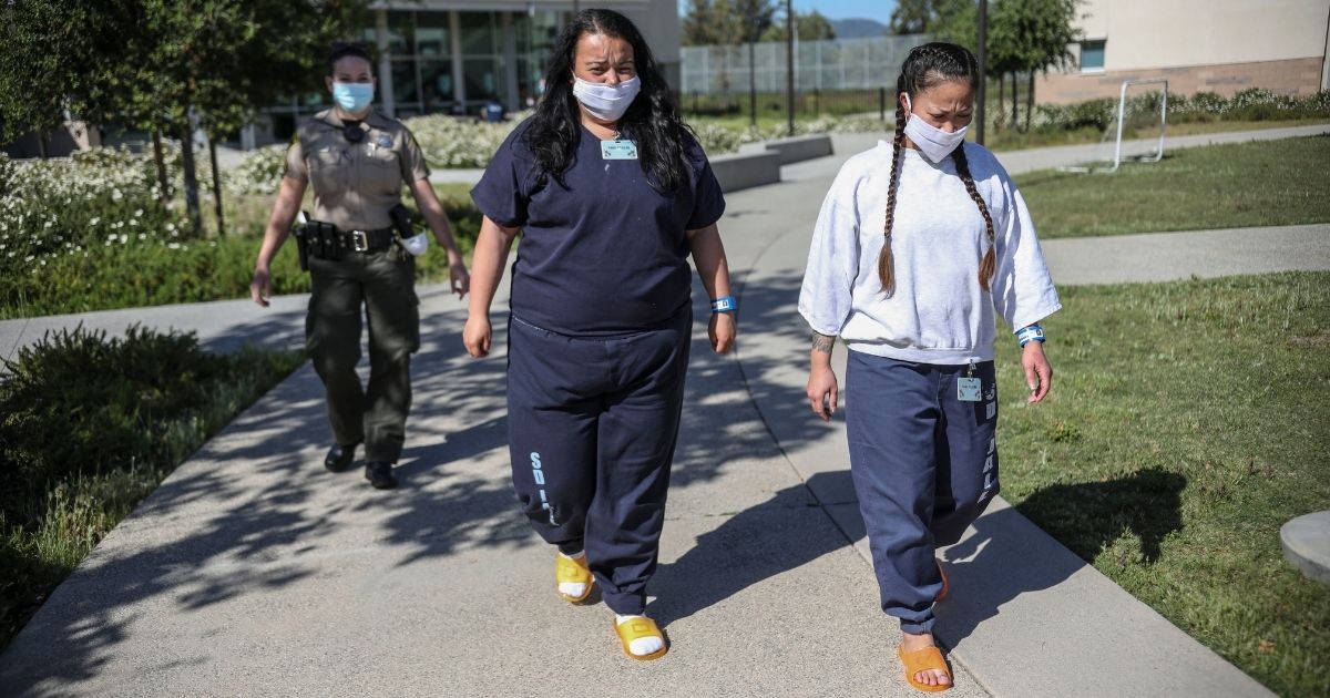 Inmates walk during recess at Las Colinas Women's Detention Facility in Santee, California, on April 22, 2020.