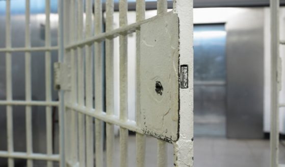 The above stock image shows an empty jail cell.