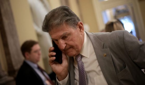 Democratic Sen. Joe Manchin of West Virginia arrives for a bipartisan meeting on infrastructure legislation at the U.S. Capitol on Tuesday in Washington, D.C.