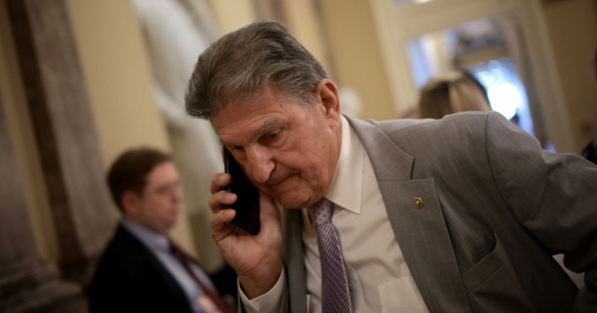 Democratic Sen. Joe Manchin of West Virginia arrives for a bipartisan meeting on infrastructure legislation at the U.S. Capitol on Tuesday in Washington, D.C.
