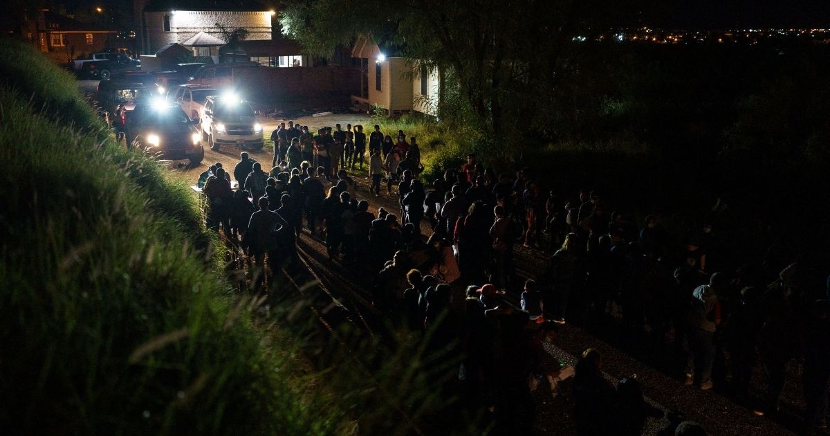Border Patrol agents process dozens of migrants who crossed the U.S.-Mexico border into Roma, Texas, on July 9.