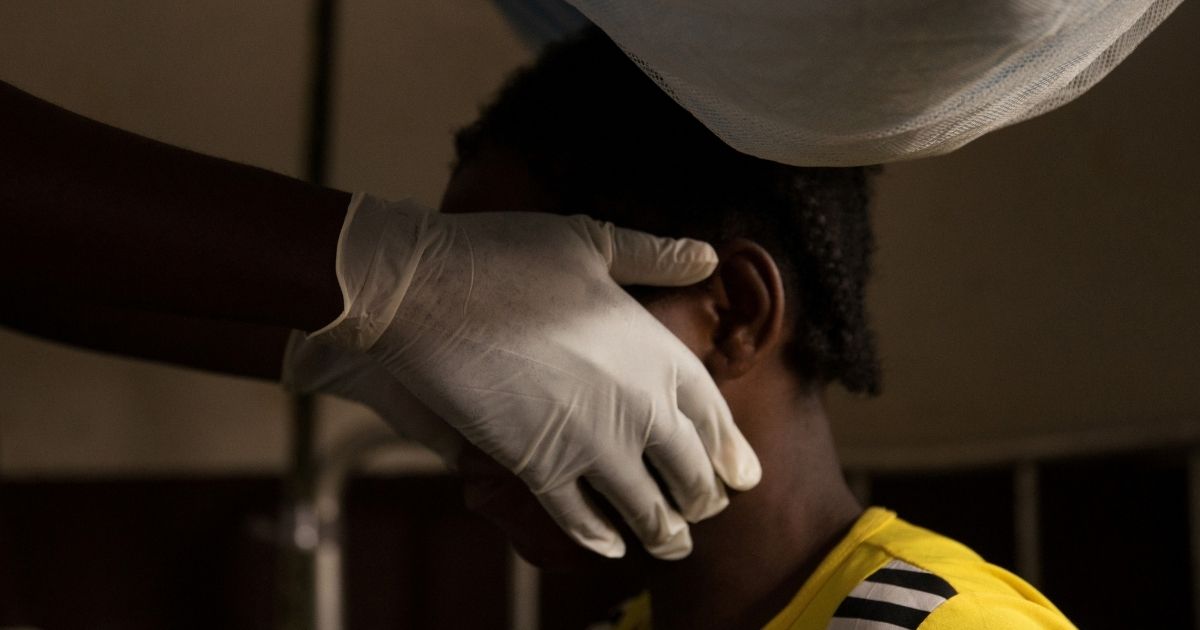 A doctor examines a woman infected with monkeypox at a quarantine area of the centre of the International medical NGO Doctors Without Borders in Zomea Kaka, in the Lobaya region, in the Central African Republic on Oct. 18, 2018.
