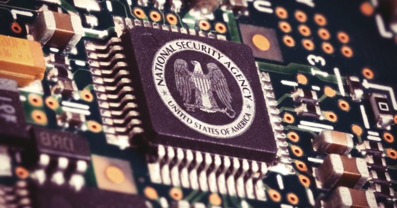 The seal of the National Security Agency is pictured inside a computer.